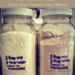 Jars of homemade yellow and chocolate mug cake mix labeled with simple instructions, with the title “Kitchen Witch’s Mug Cake” and the tagline “Stir Up a Little Magic – Single-Serve Chocolate Cake in Minutes.”