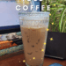 Pinterest graphic featuring a glass of iced coffee labeled “Thyme Iced Coffee,” with sparkles, set on a cozy desk surrounded by green plants and books.