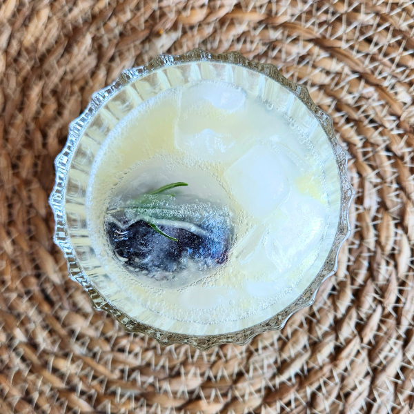 Sparkling lemonade mocktail with rosemary and blueberries