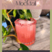 Pinterest graphic featuring a pink Witchlight Fizz mocktail in a faceted glass, rimmed with raspberry citrus salt and garnished with mint. Surrounded by trailing houseplants, with text overlay: Witchlight Fizz Mocktail – for Stargazers & Dreamers.